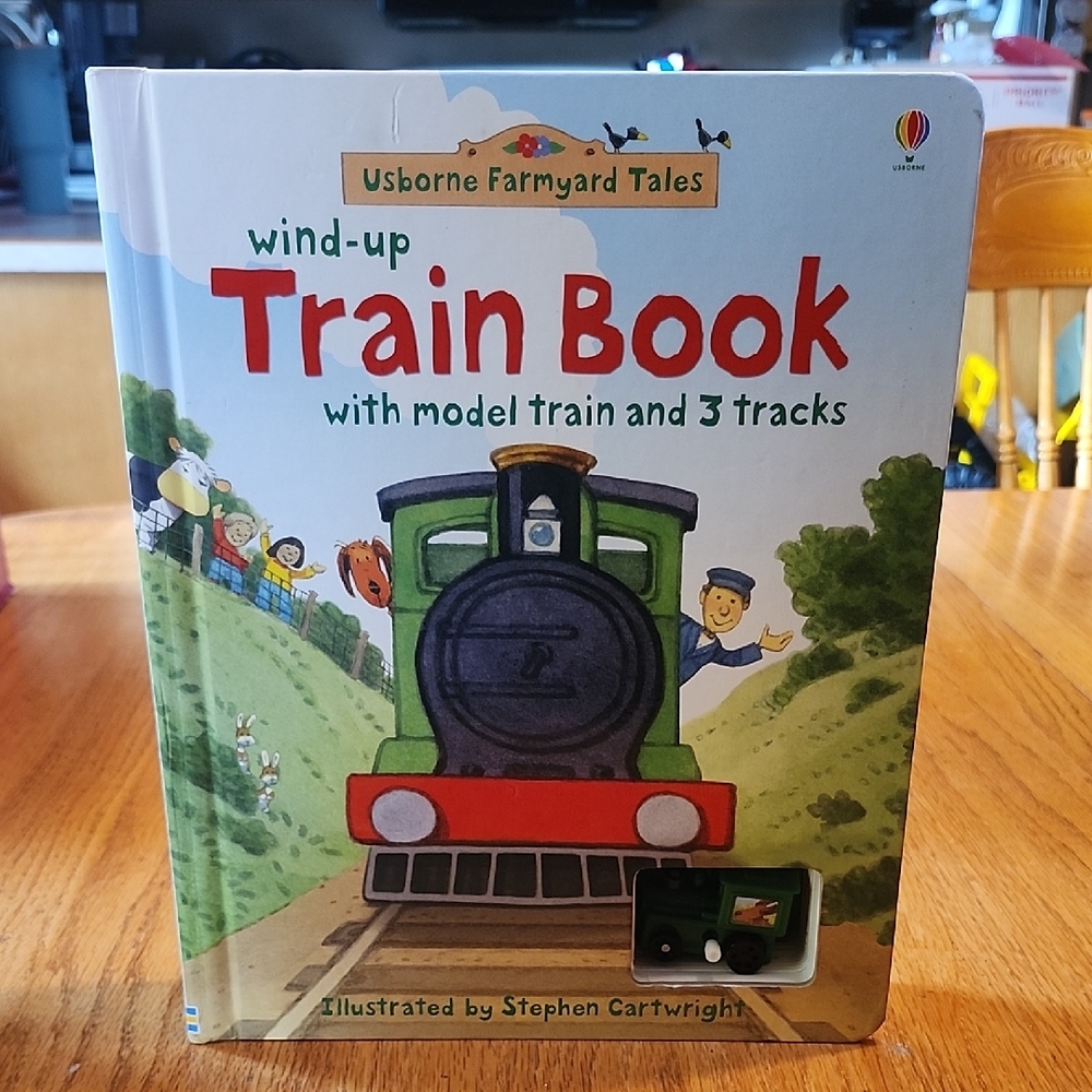 Usborne Farmyard Tales Wind-Up Train Book with model train and three tracks